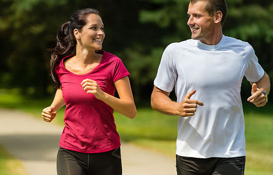Couple jogging together to get healthy in Encinitas
