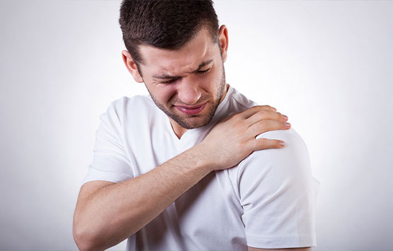 Man suffering with frozen shoulder in need of a chiropractic adjustment at Encinitas Auto Accident Injury Center in Encinitas