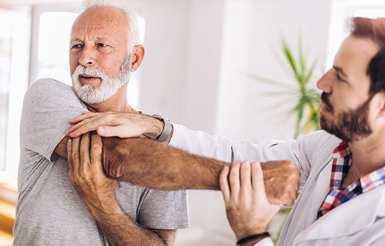 Patient getting a chiropractic shoulder adjustment at Encinitas Auto Accident Injury Center in Encinitas