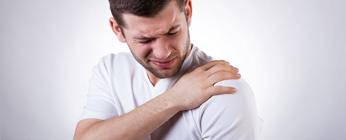 Man suffering with frozen shoulder in need of a chiropractic adjustment at Encinitas Auto Accident Injury Center in Encinitas