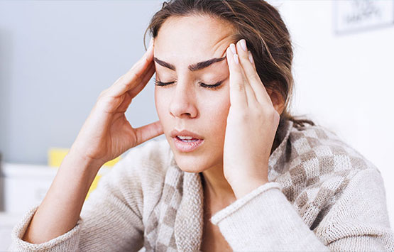 Woman suffering with headache