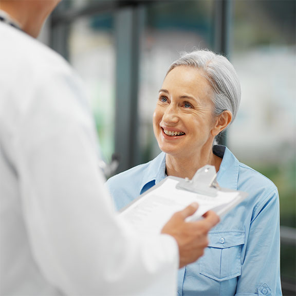 Chiropractor at Encinitas Auto Accident Injury Center in Encinitas reviewing patient's medical history